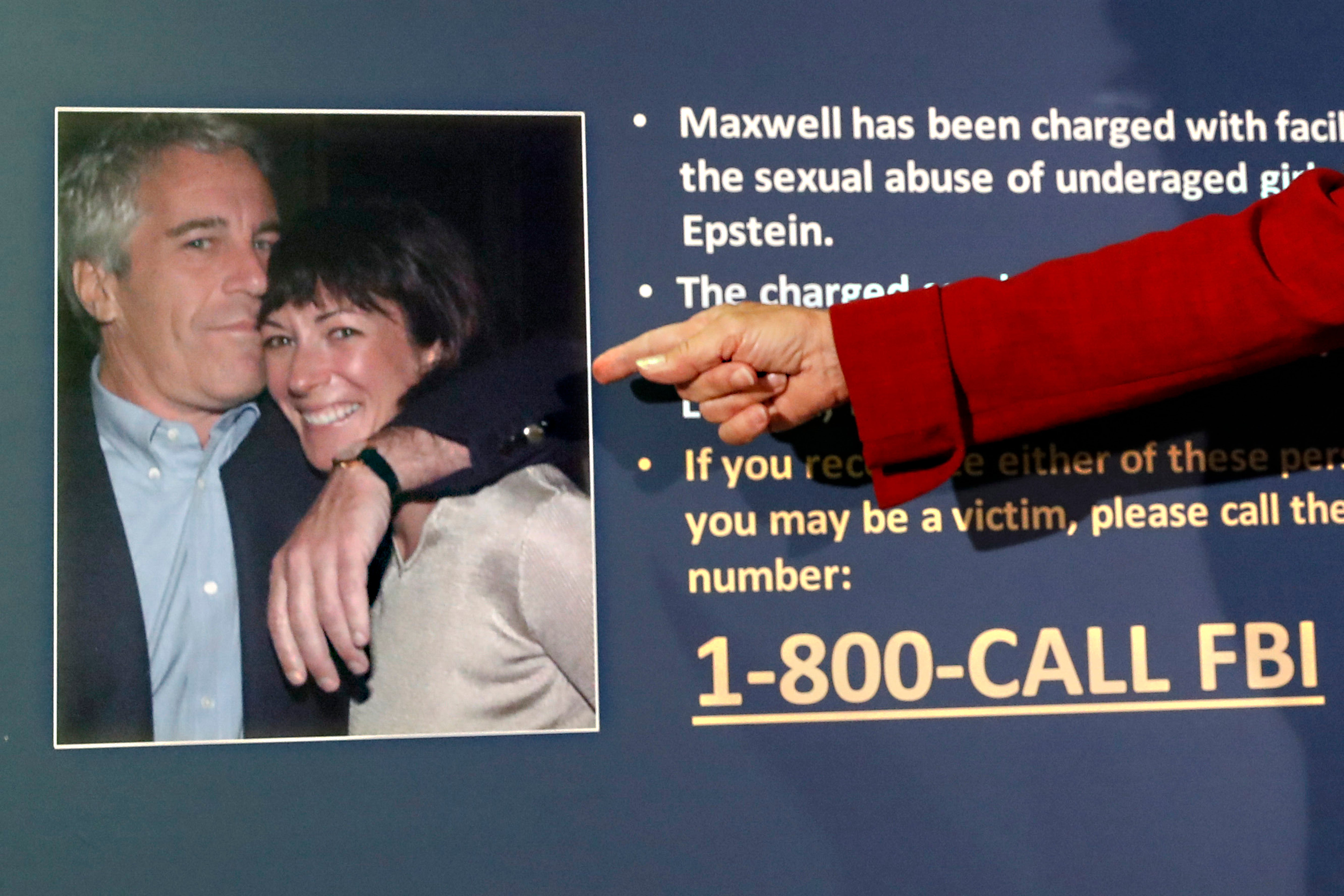 A prosecutor points to a photo of Jeffrey Epstein and Ghislaine Maxwell during a news conference prior to Maxwell’s trial in 2021