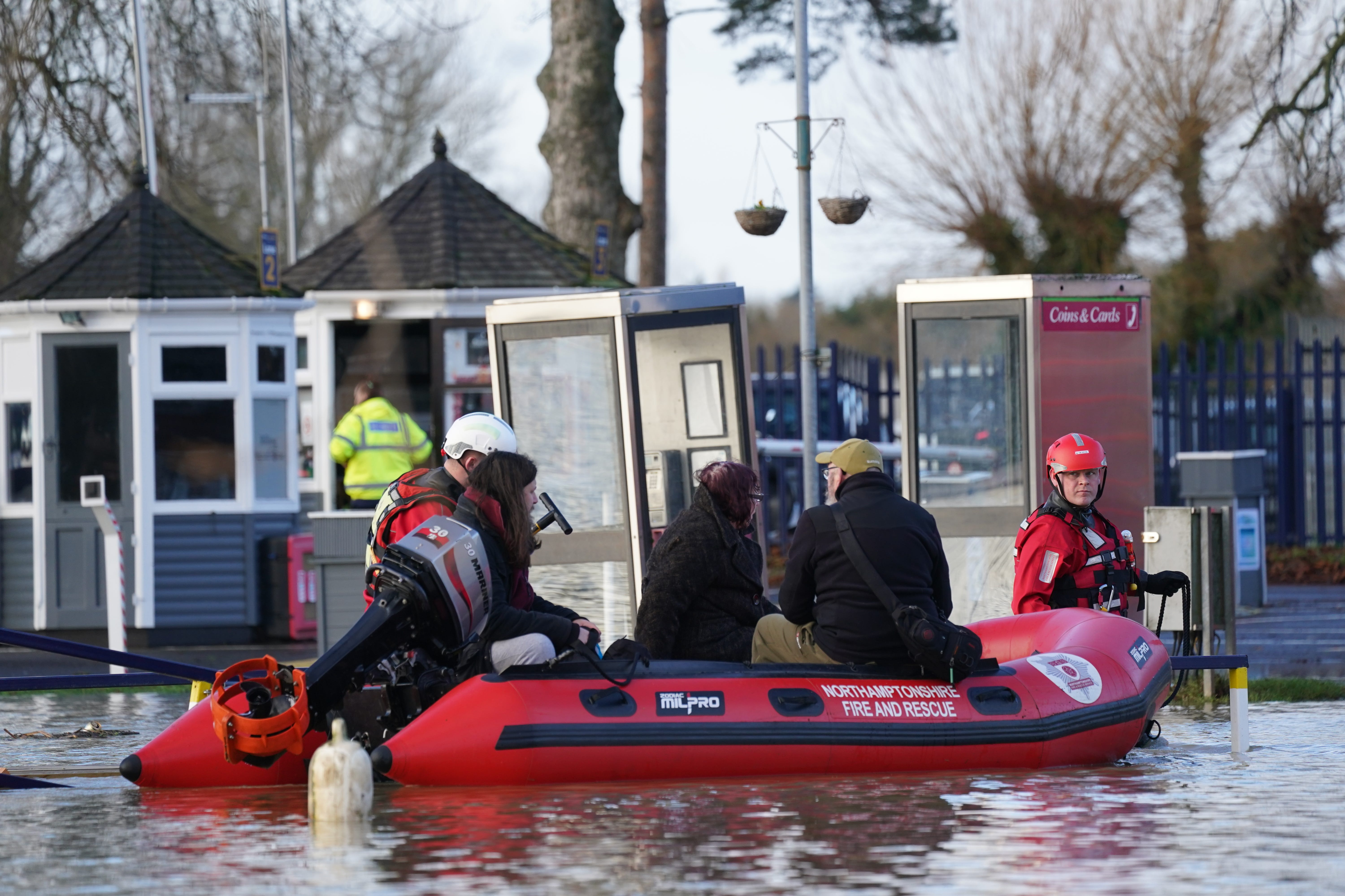 People are rescued from houseboats at Billing Aquadrome in Northampton (Jacob King/PA)