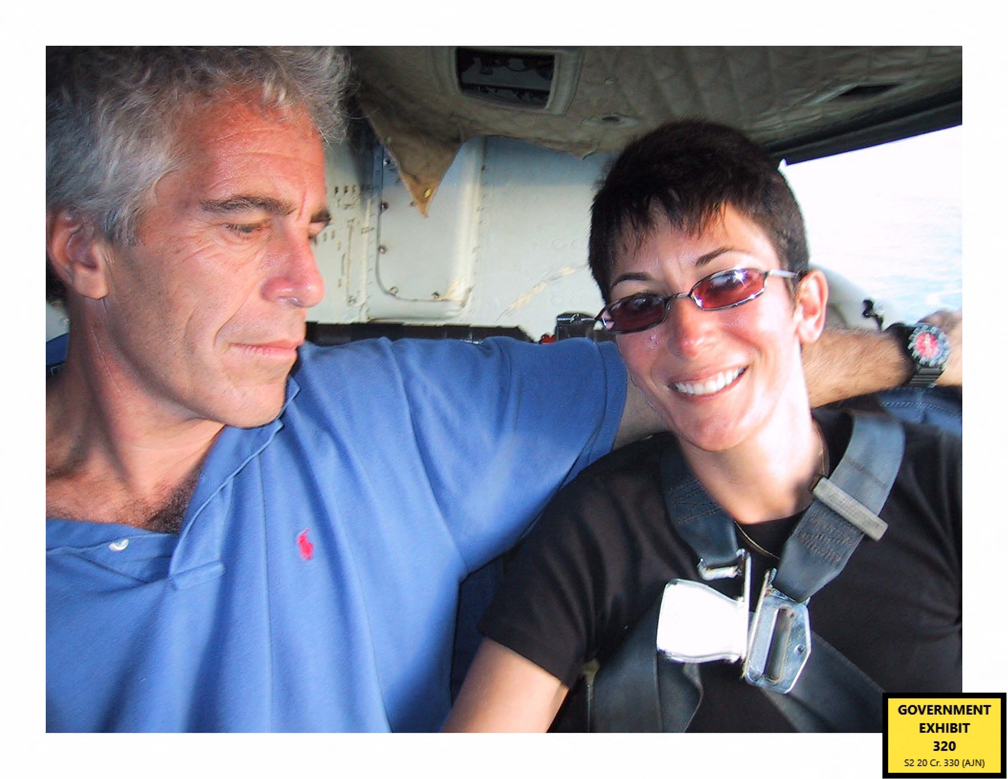 This undated trial evidence image obtained on 8 December 2021, from the US District Court for the Southern District of New York shows British socialite Ghislaine Maxwell and US financier Jeffrey Epstein