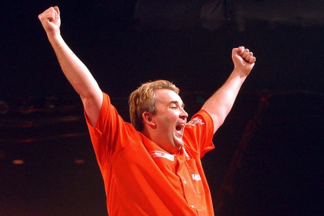 Phil Taylor celebrates after winning the 2004 world title in dramatic style (Sean Dempsey/PA)