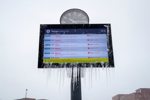 <p>Icicles adorn a sign with departures cancellations caused by heavy snowfall in Viborg, central Jutland, Denmark</p>
