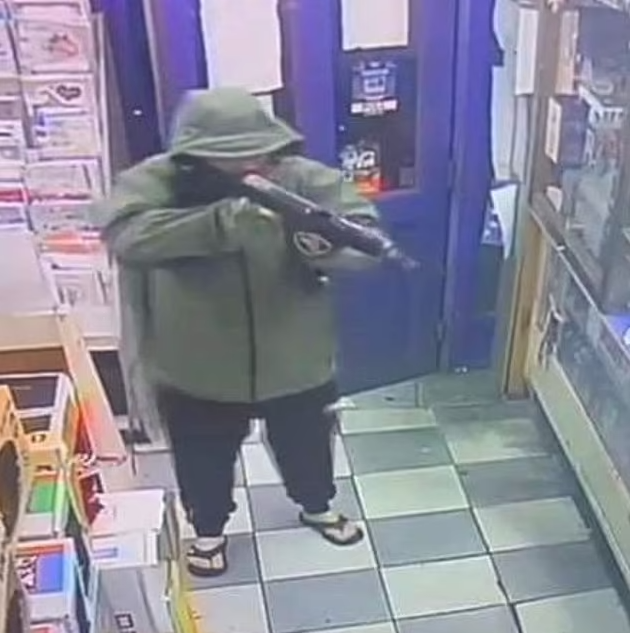 pCCTV from the newsagent appears to show a hooded man carrying a large firearm /p