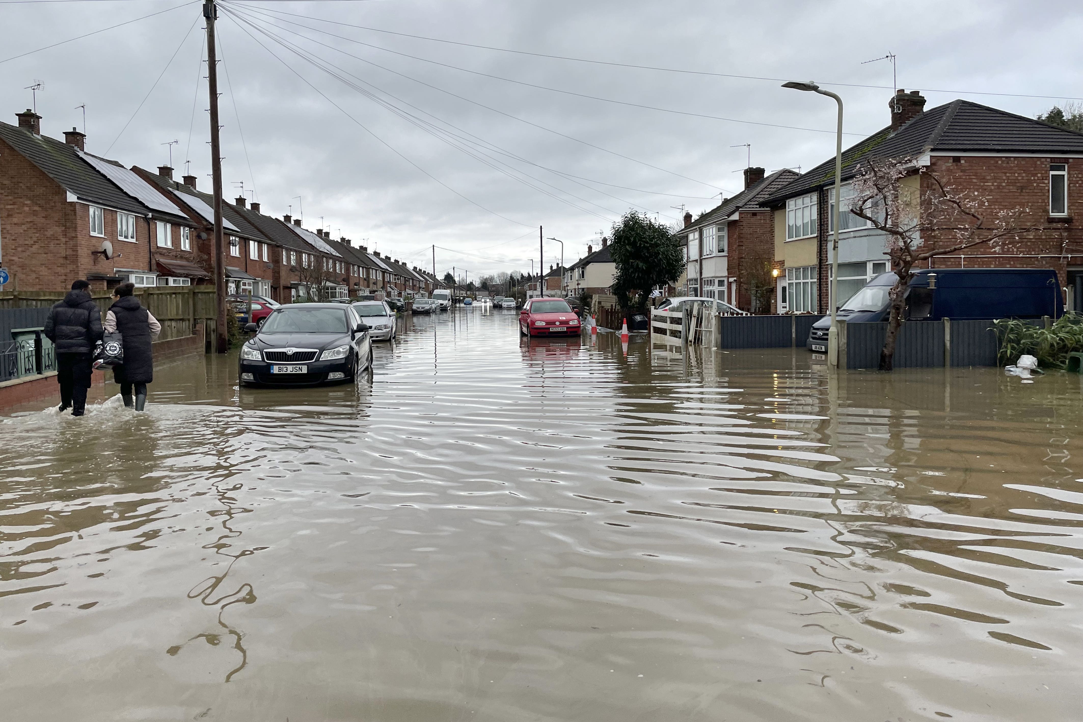 A residential street is flooded in Loughborough, Leicestershire, after rain and strong winds from Storm Henk (PA)