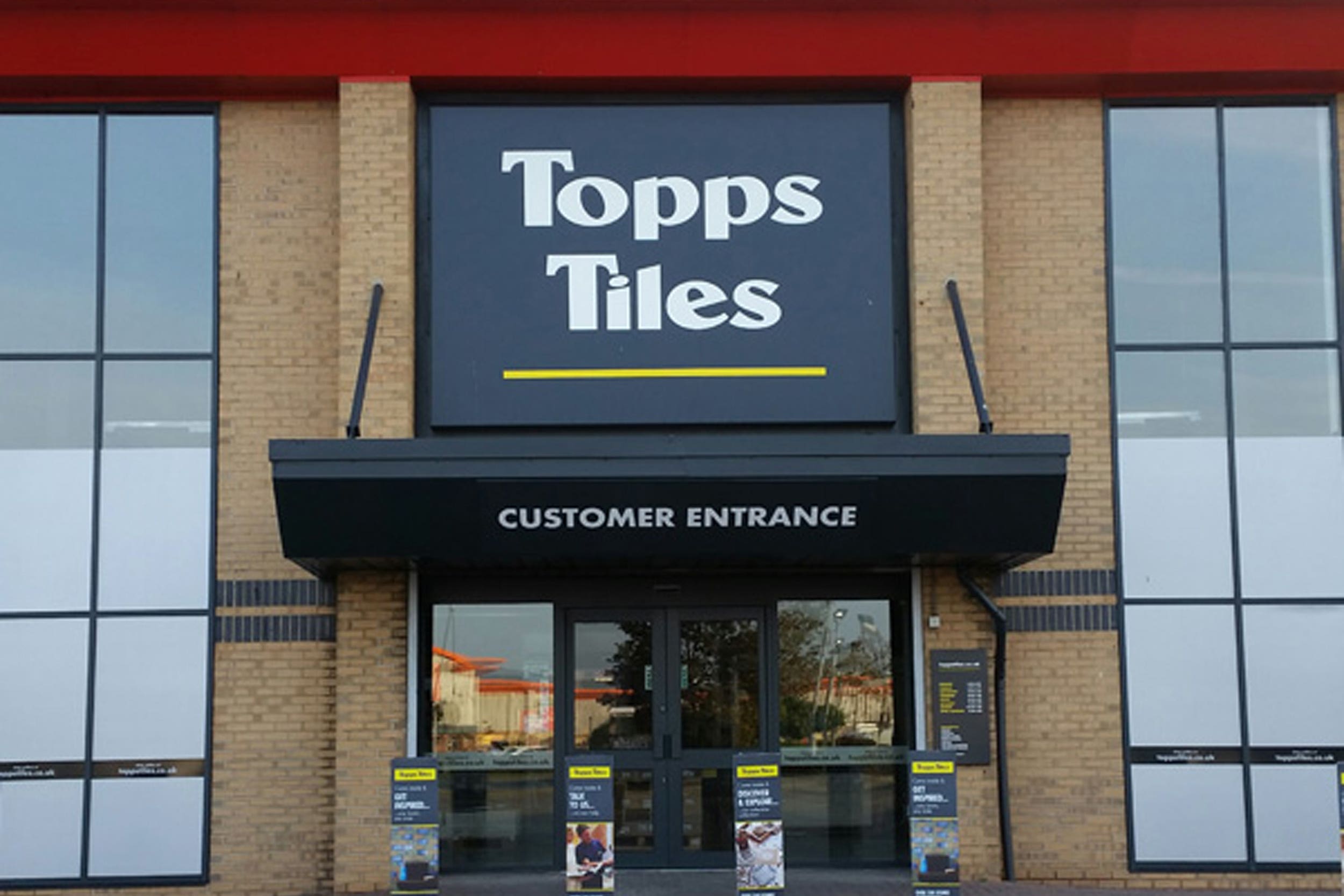 Topps said that sales to homeowners had dropped off more than those to builders (Topps Tiles/PA)