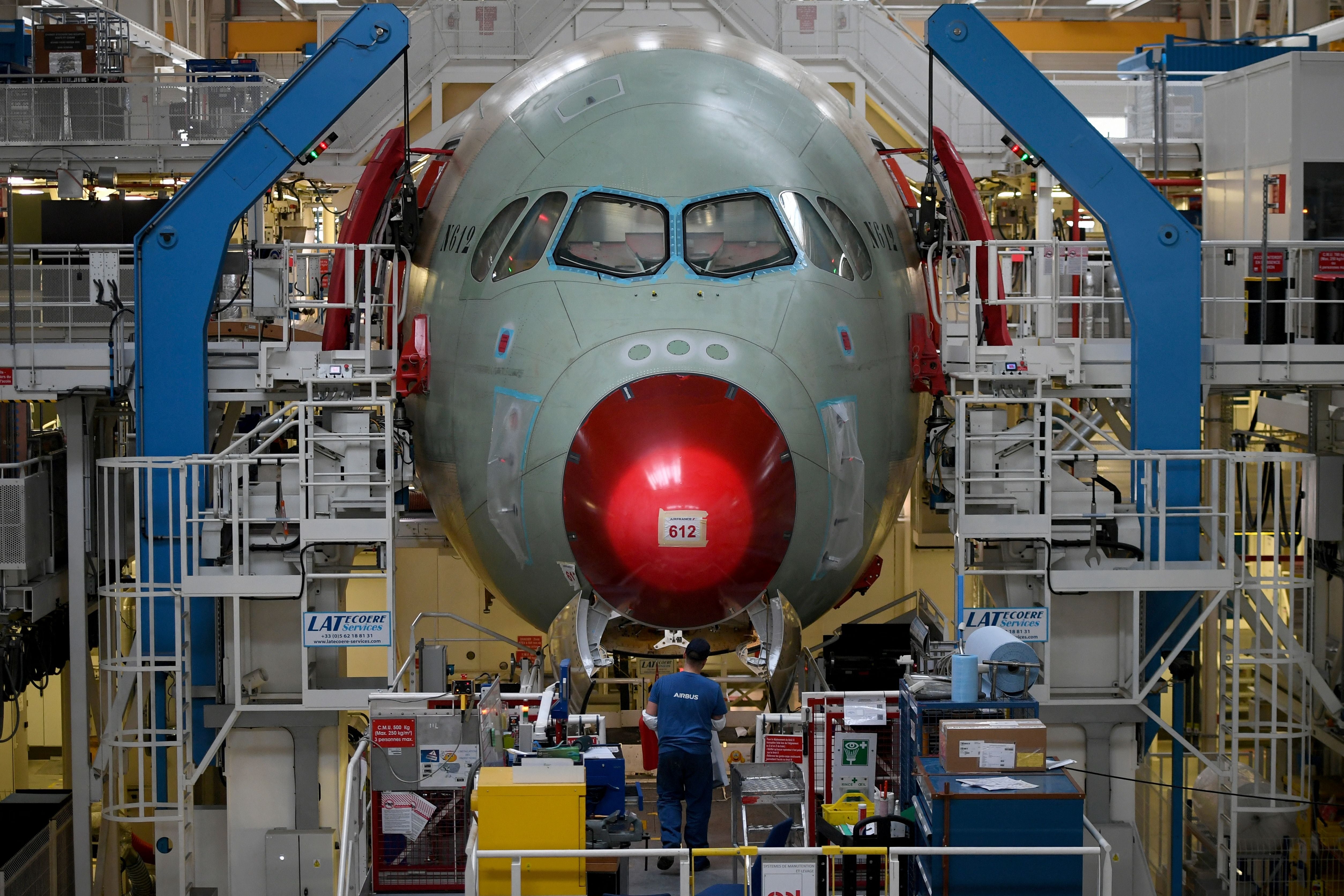 An employee works at the Airbus A350 assembly site, in Colomiers near Toulouse, south-western France