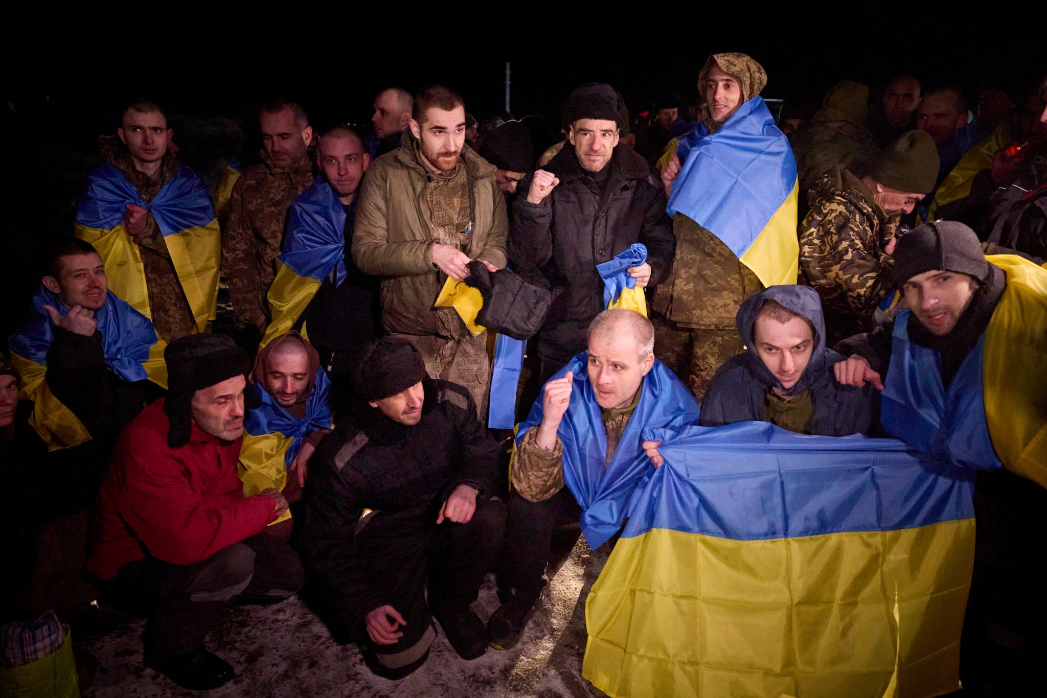 Ukrainian prisoners of war pose for a photo after a prisoner exchange near Sumy, Ukraine, Wednesday, 3 January 2024