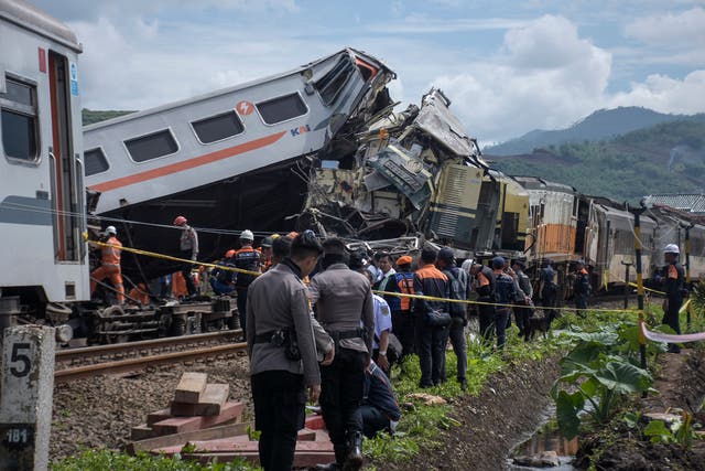 <p>Rescuers inspect the wreckage after the collision between two trains in Cicalengka, West Java, Indonesia, Friday, 5 January 2024. The trains collided on Indonesia's main island of Java on Friday, causing several carriages to buckle and overturn and killing at least a few people, officials said</p>