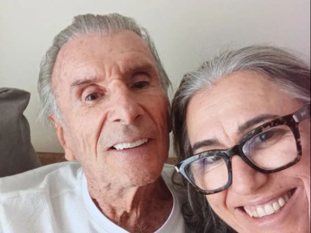 <p>Wilson Fittipaldi Jr. (left) pictured alongside his wife shortly before his cardiac arrest on Christmas Day</p>