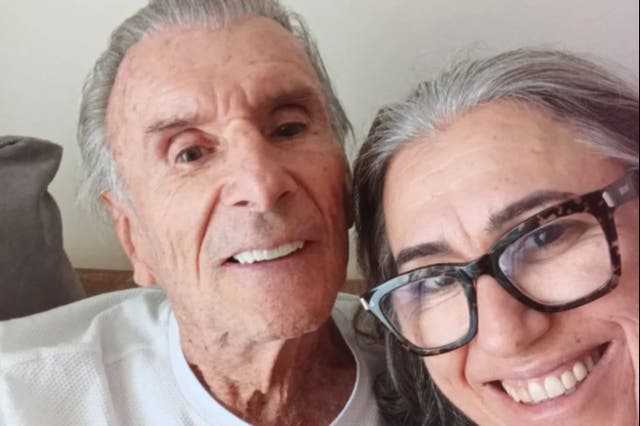 <p>Wilson Fittipaldi Jr. (left) pictured alongside his wife shortly before his cardiac arrest on Christmas Day</p>