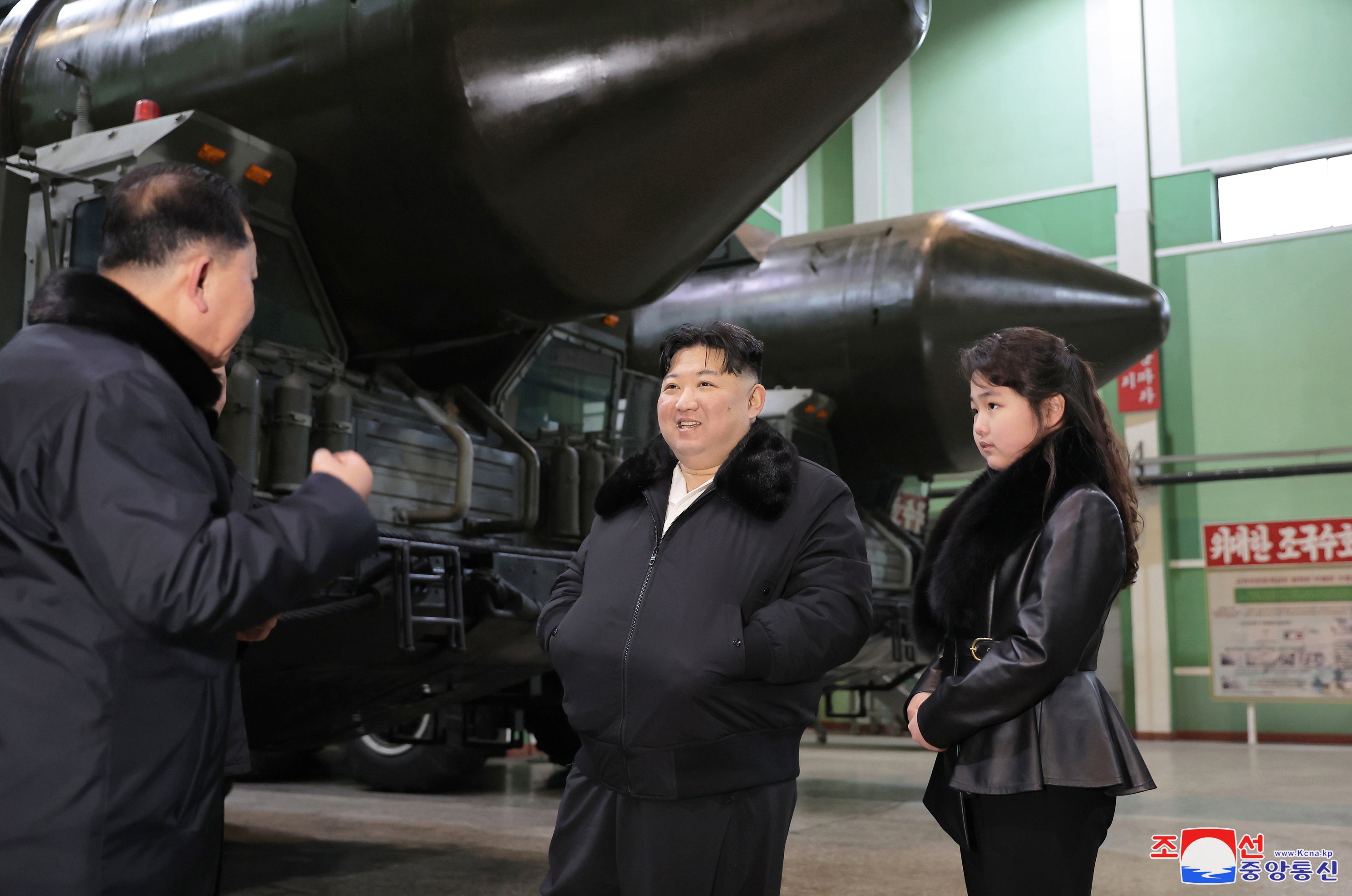North Korean leader Kim Jong Un and his daughter Ju Ae inspect a missile launcher production facility in a photo released in January 2024