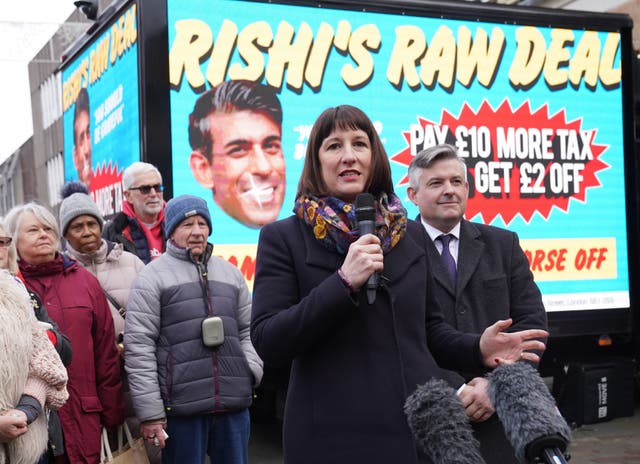 <p>Shadow chancellor Rachel Reeves and shadow paymaster general Jonathan Ashworth (right) in Wellingborough, North Northamptonshire, on Friday to unveil Labour’s poster campaign of what it calls ‘Rishi’s raw deal’ for taxpayers ahead of the reduction in national insurance contributions on 6 January</p>