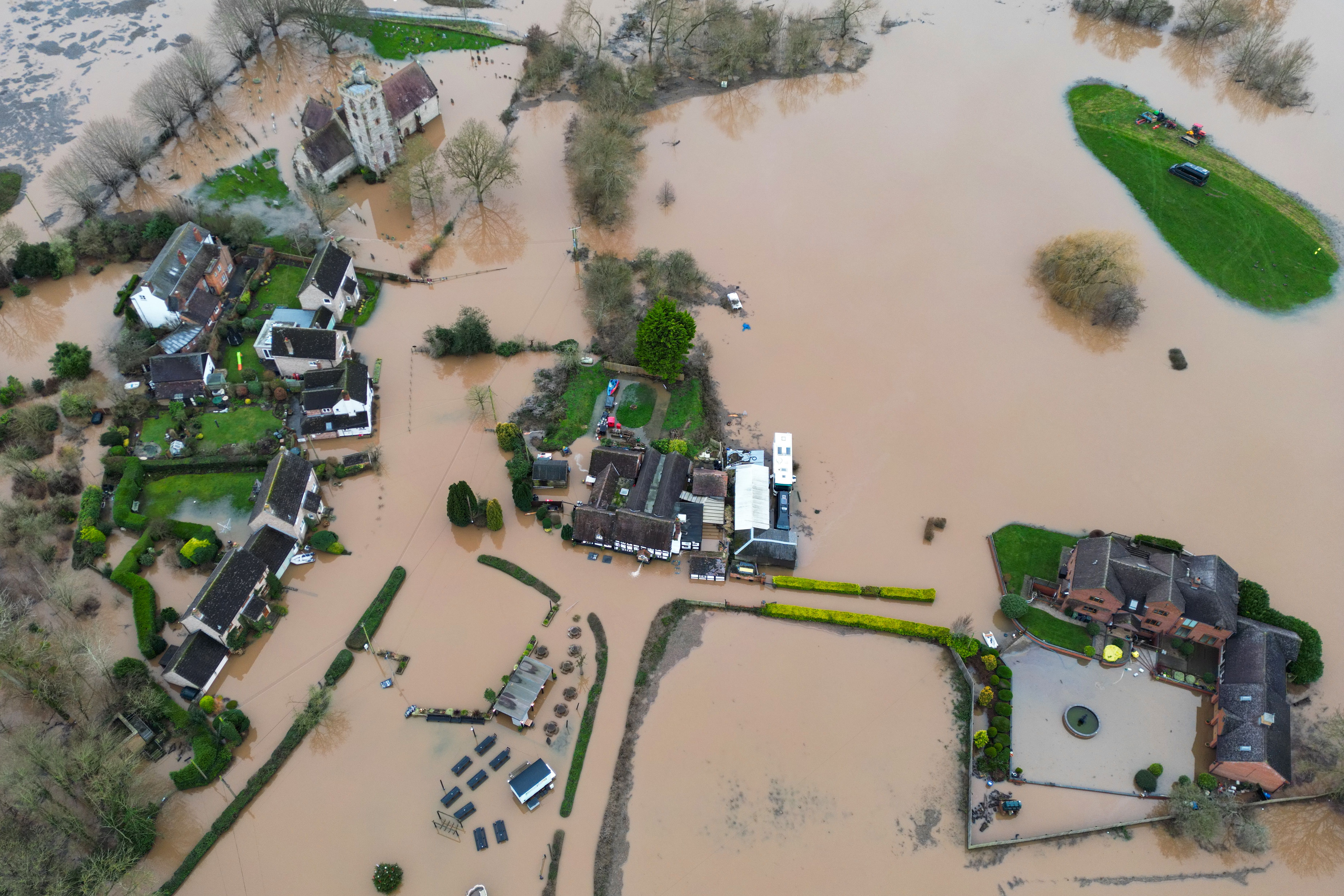 A view of the Rose & Crown pub in Worcester flooded by the River Severn following heavy rainfall (David Davies / PA)