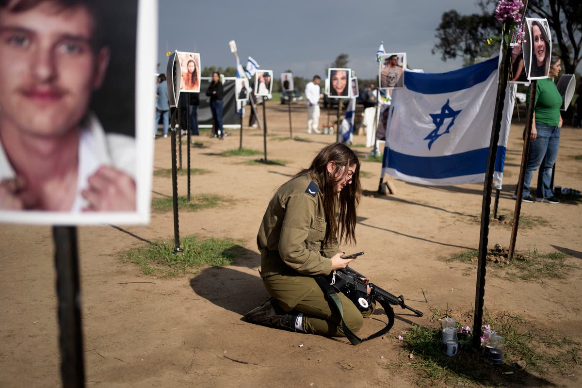 Hezbollah fires rockets at Israel in 'initial response' to killing of top leader from allied Hamas