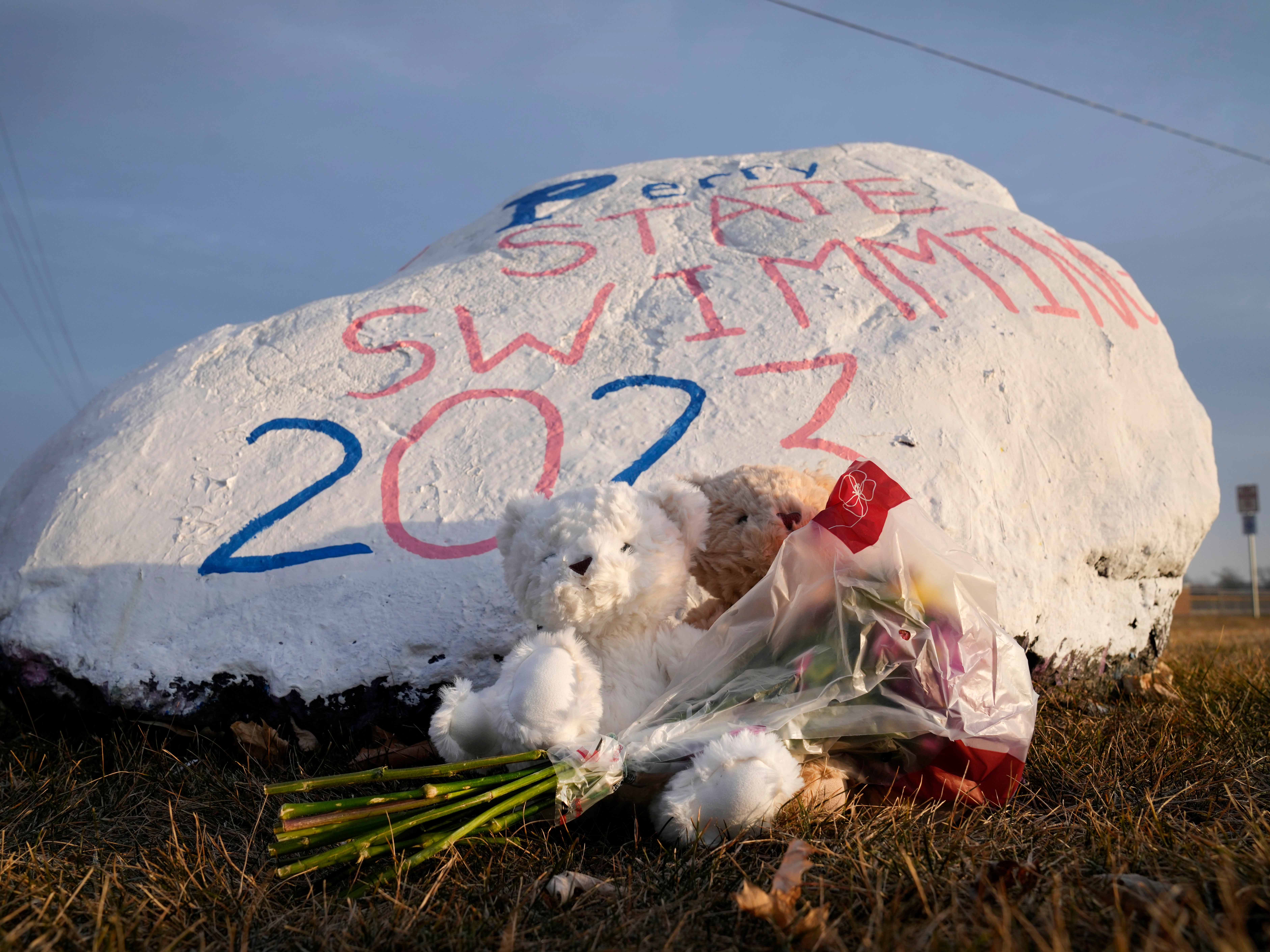 Teddy bears and flowers are seen outside of Perry High School following a shooting Thursday at the school, Friday, Jan. 5, 2024, in Perry, Iowa