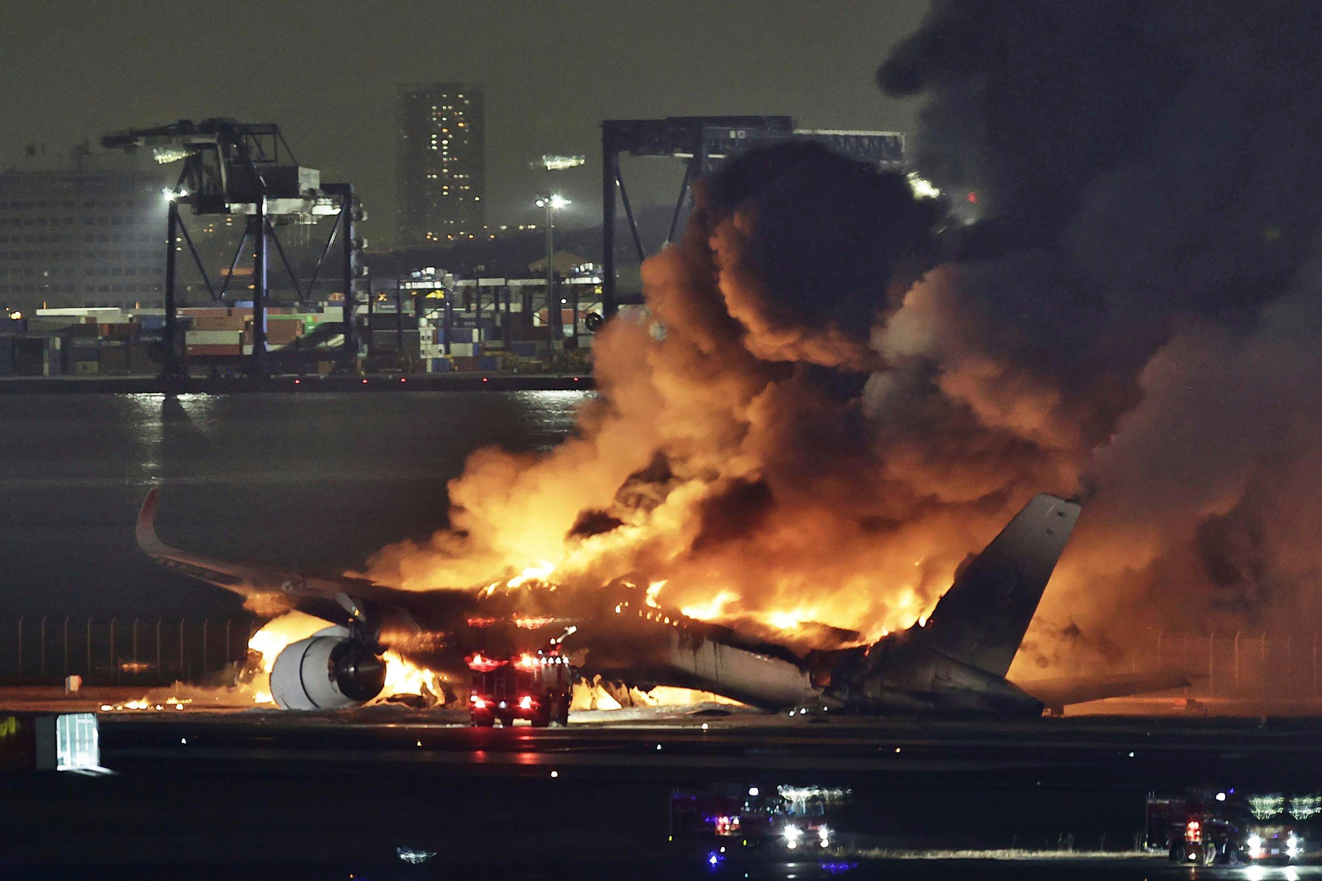 A Japan Airlines plane is on fire on the runway of Haneda airport in Tokyo, on 2 January 2024