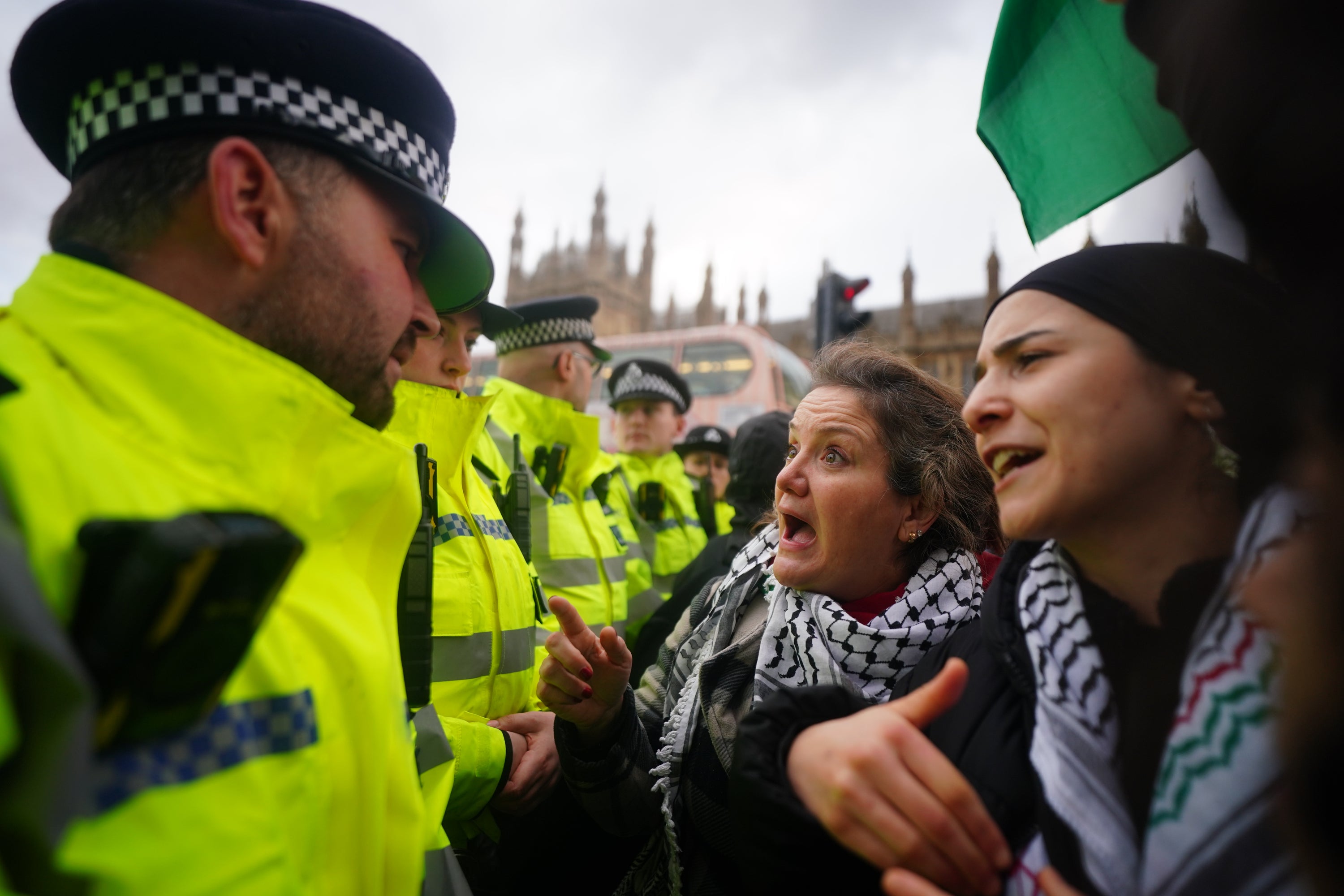 Protesters argue with police who formed a cordon on Westminster Bridge