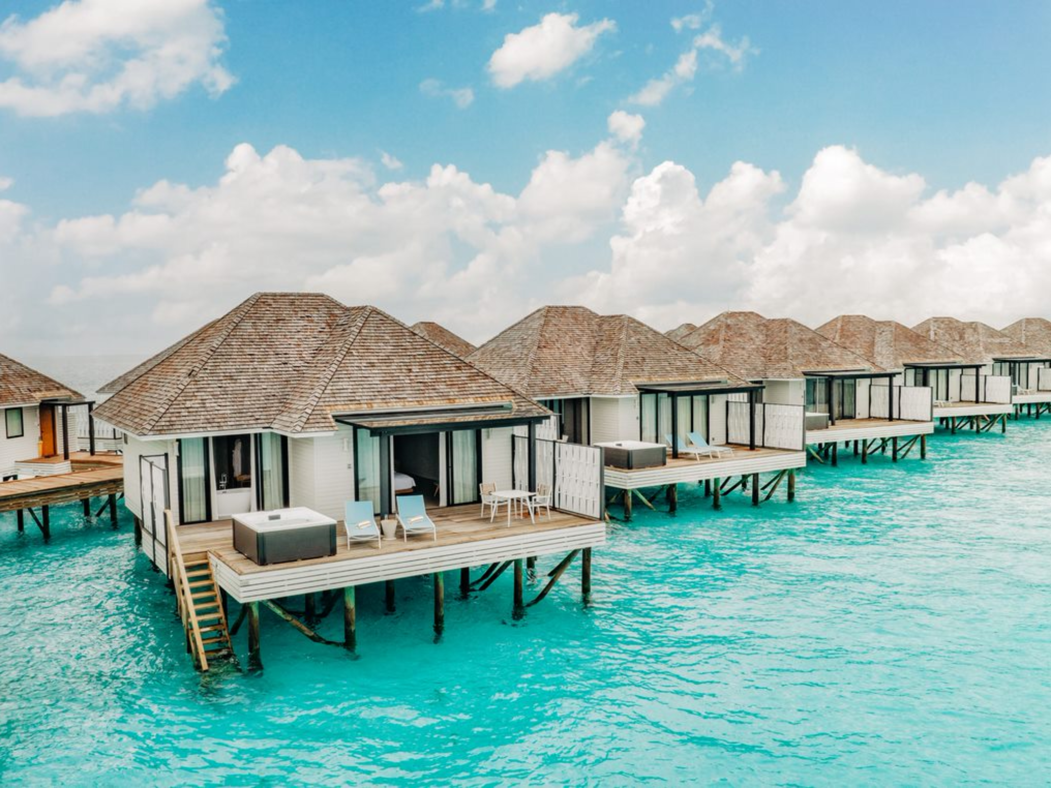 The water villas offer sunrise or sunset views
