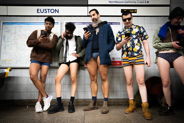 <p>People at Euston station in London as they take part in the annual No Trousers Tube Ride (James Manning/PA)</p>