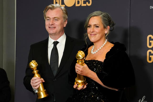 Christopher Nolan, left, and Emma Thomas pose in the press room with the award for best motion picture, drama for Oppenheimer (Chris Pizzello/AP)