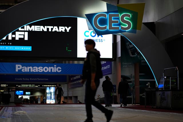 People walk through the Las Vegas Convention Centre during setup ahead of the CES tech show in Las Vegas (John Locher/AP)
