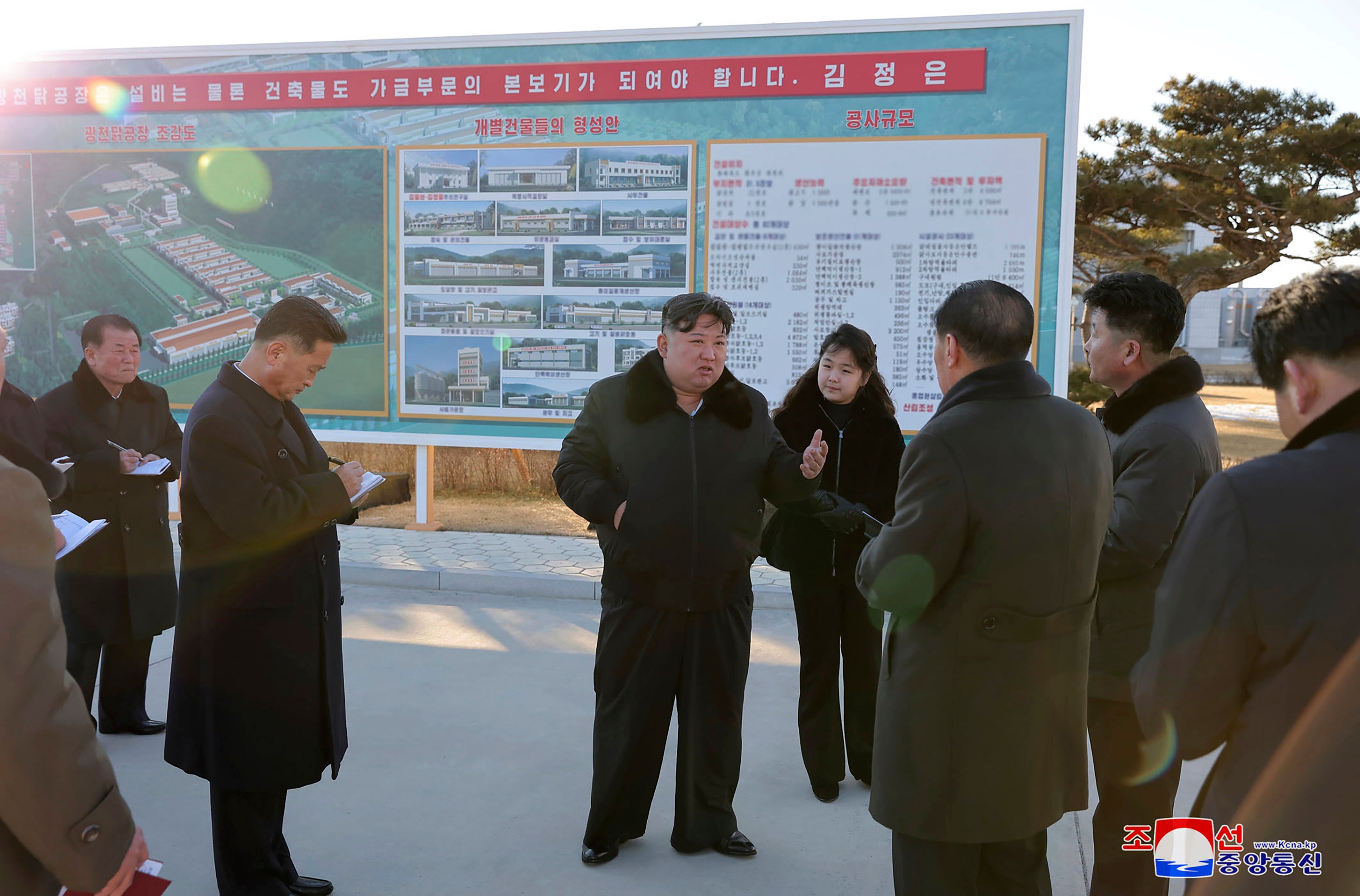 In this photo provided on Monday, 8 January 2024, by the North Korean government, North Korean leader Kim Jong-un, centre, with his daughter visits a newly-built poultry factory in Hwangju County of North Hwanghae Province on 7 January 2024