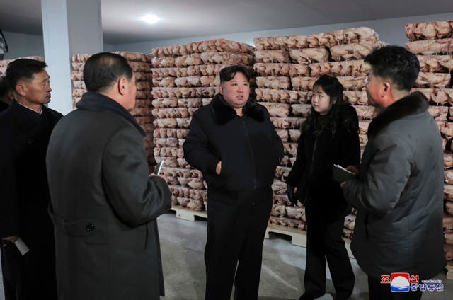 <p>In this photo provided on Monday, 8 January 2024, by the North Korean government, North Korean leader Kim Jong-un, centre, with his daughter visits a newly-built poultry factory in Hwangju County of North Hwanghae Province on 7 January 2024</p>