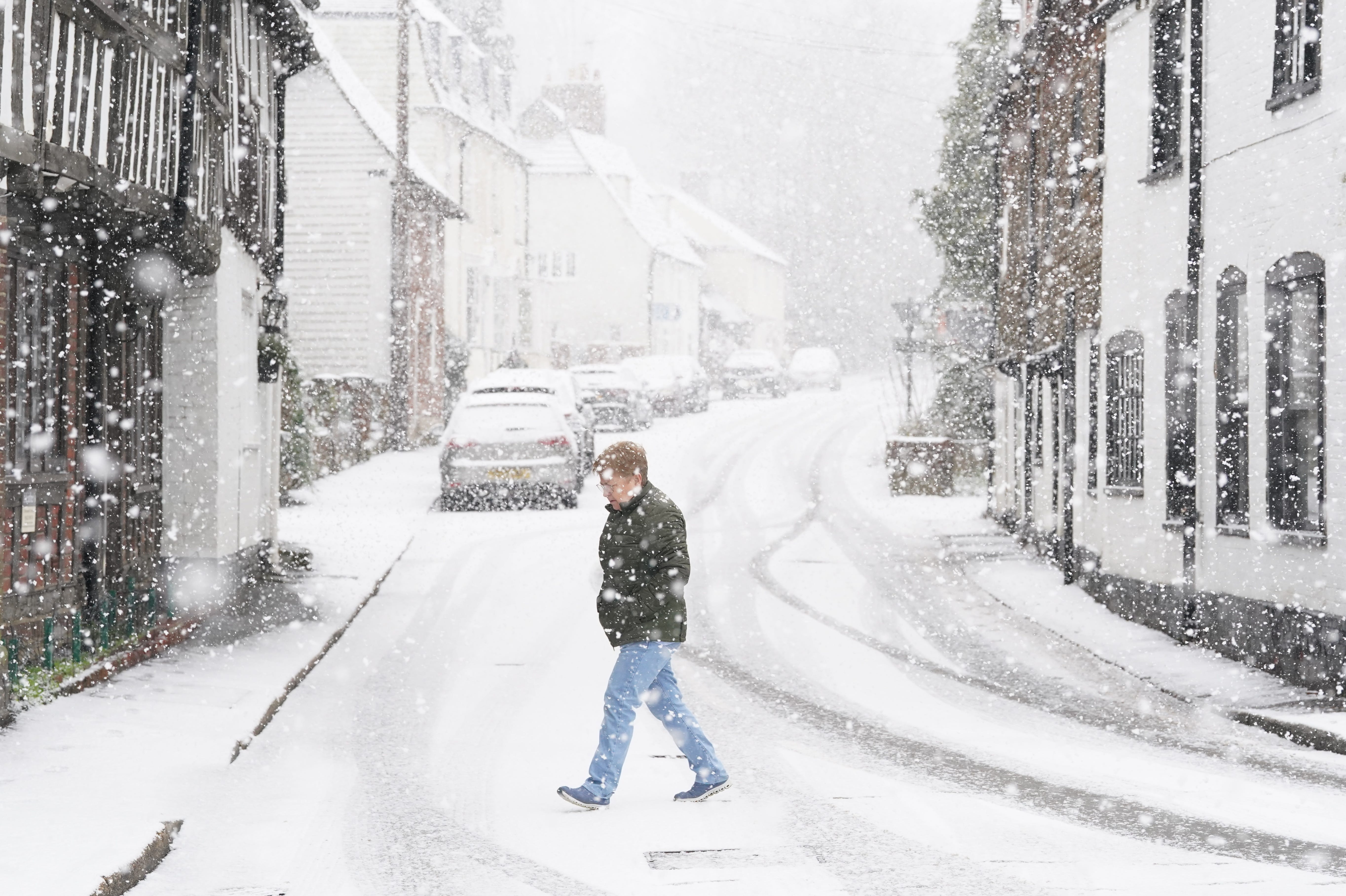 A person walking through a snow flurry in Lenham, Kent (Gareth Fuller/PA)