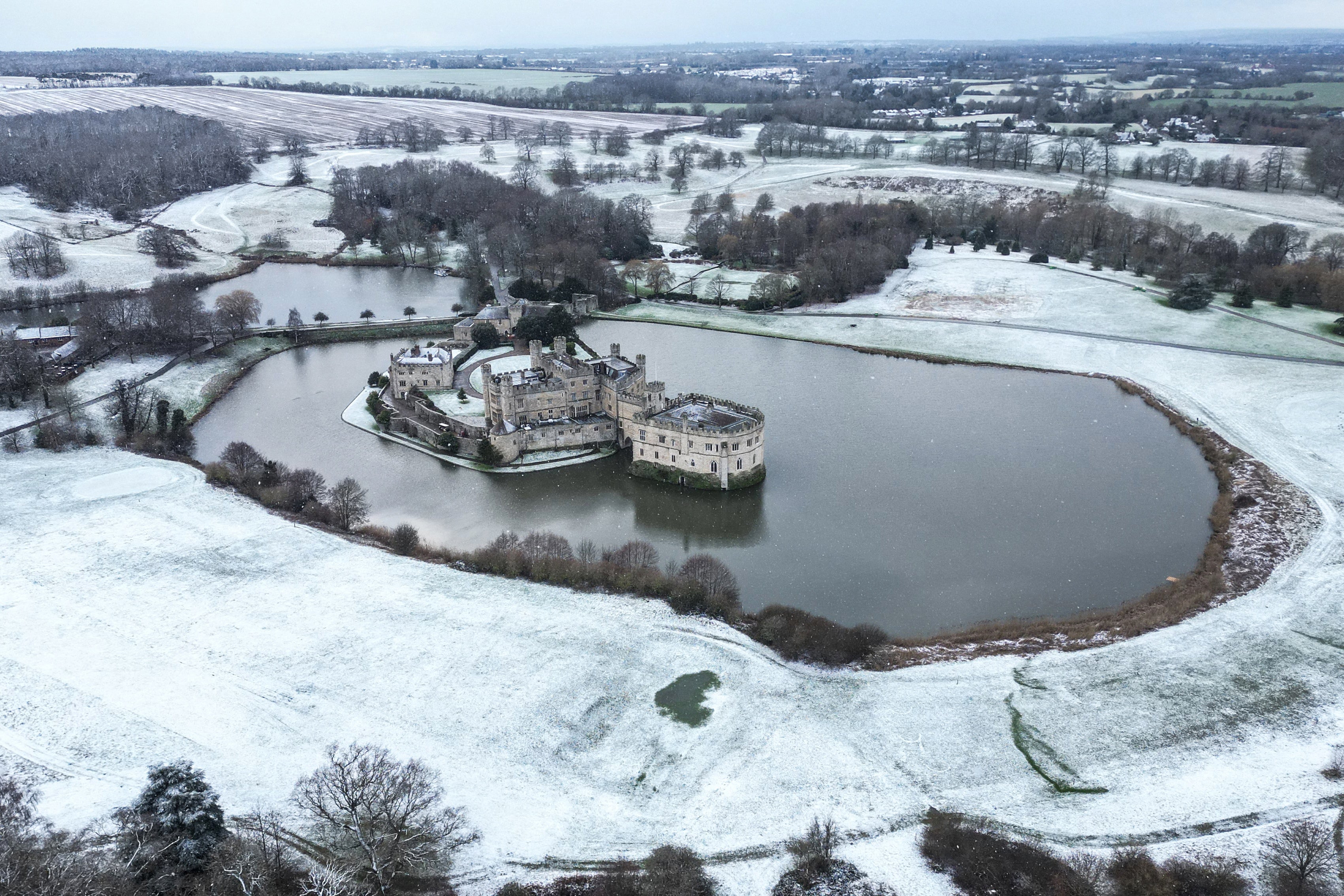An aerial view of Leeds Castle covered in snow in Maidstone, Kent,