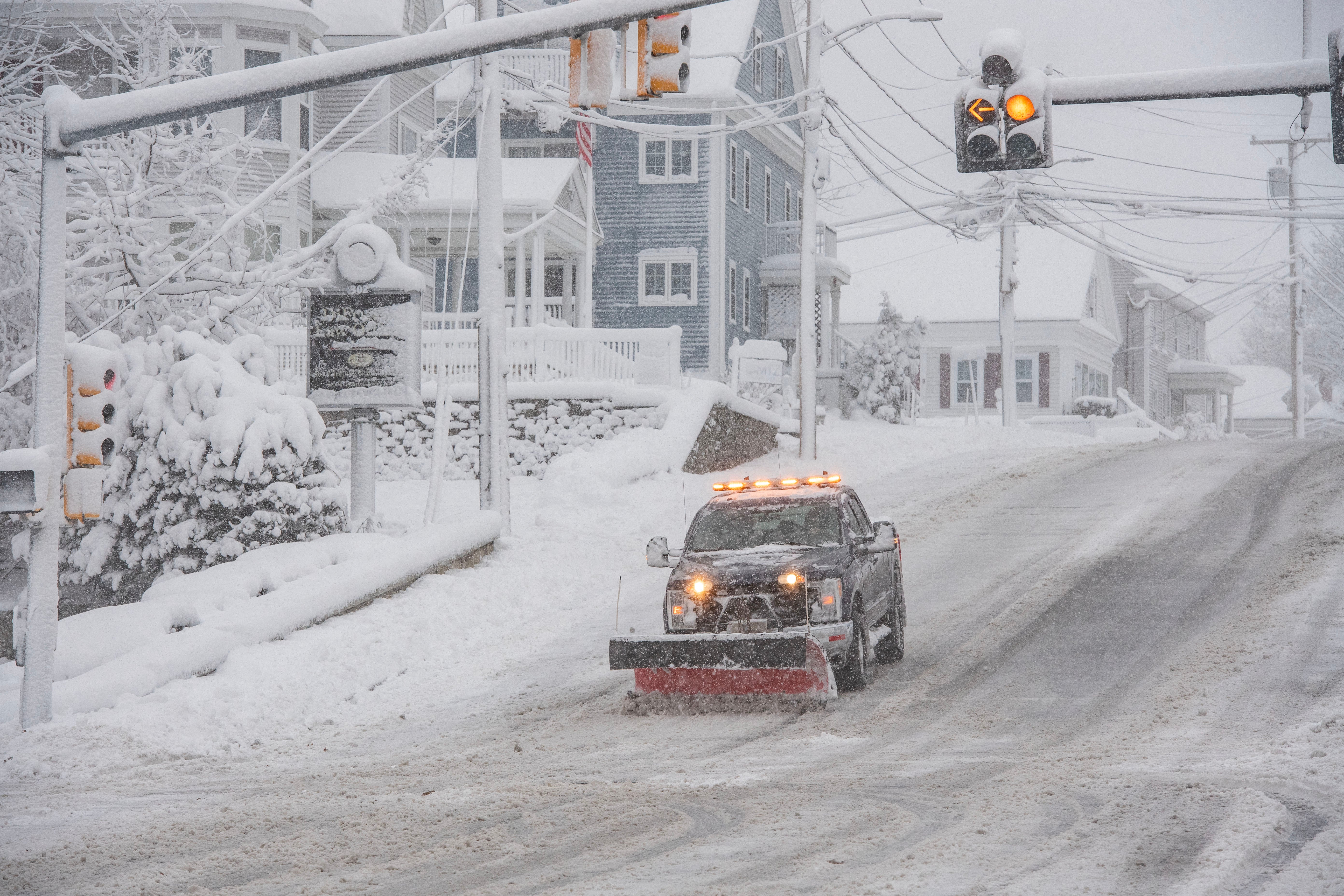 A snowplow clears snow from Broadway in Methuen, Massachusetts on January 7