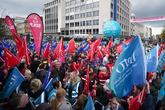 A rally outside Belfast City Hall (Niall Carson/PA)