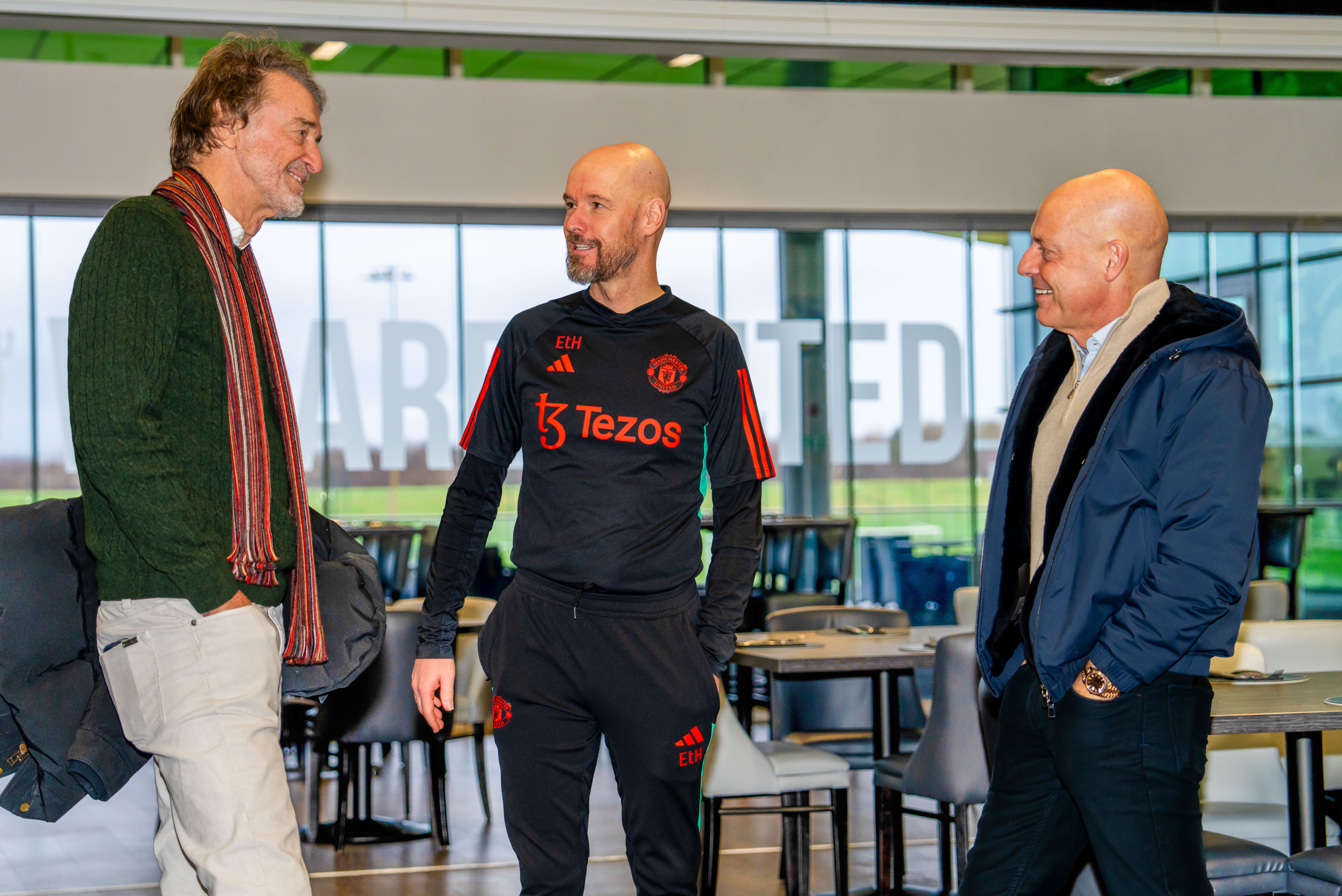 Sir Jim Ratcliffe and Sir Dave Brailsford of INEOS meet Manager Erik ten Hag of Manchester United in the staff restaurant at Carrington Training Complex