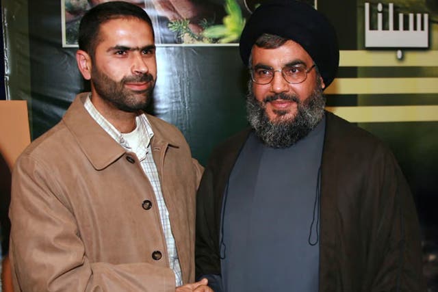 <p>Hezbollah commander Wissam Tawil, left, with Hezbollah leader Hassan Nasrallah</p>