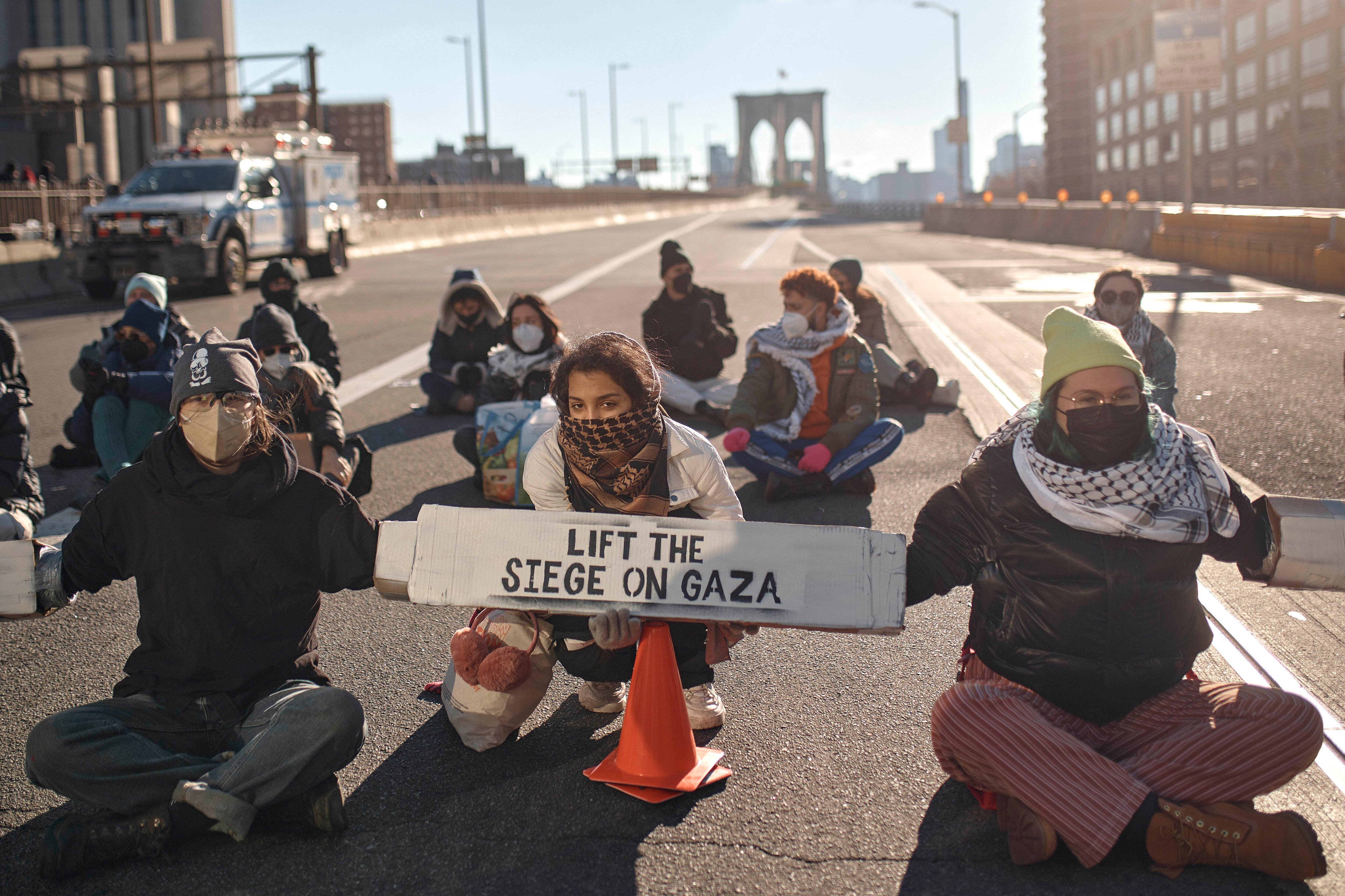 Protestors block Brooklyn Bridge during a pro-Palestinian demonstration demanding a cease-fire in the Israel-Palestinian conflict on Monday, 8 January 2024, in New York