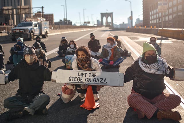 <p>Protestors block Brooklyn Bridge during a pro-Palestinian demonstration demanding a cease-fire in the Israel-Palestinian conflict on Monday, 8 January 2024, in New York</p>