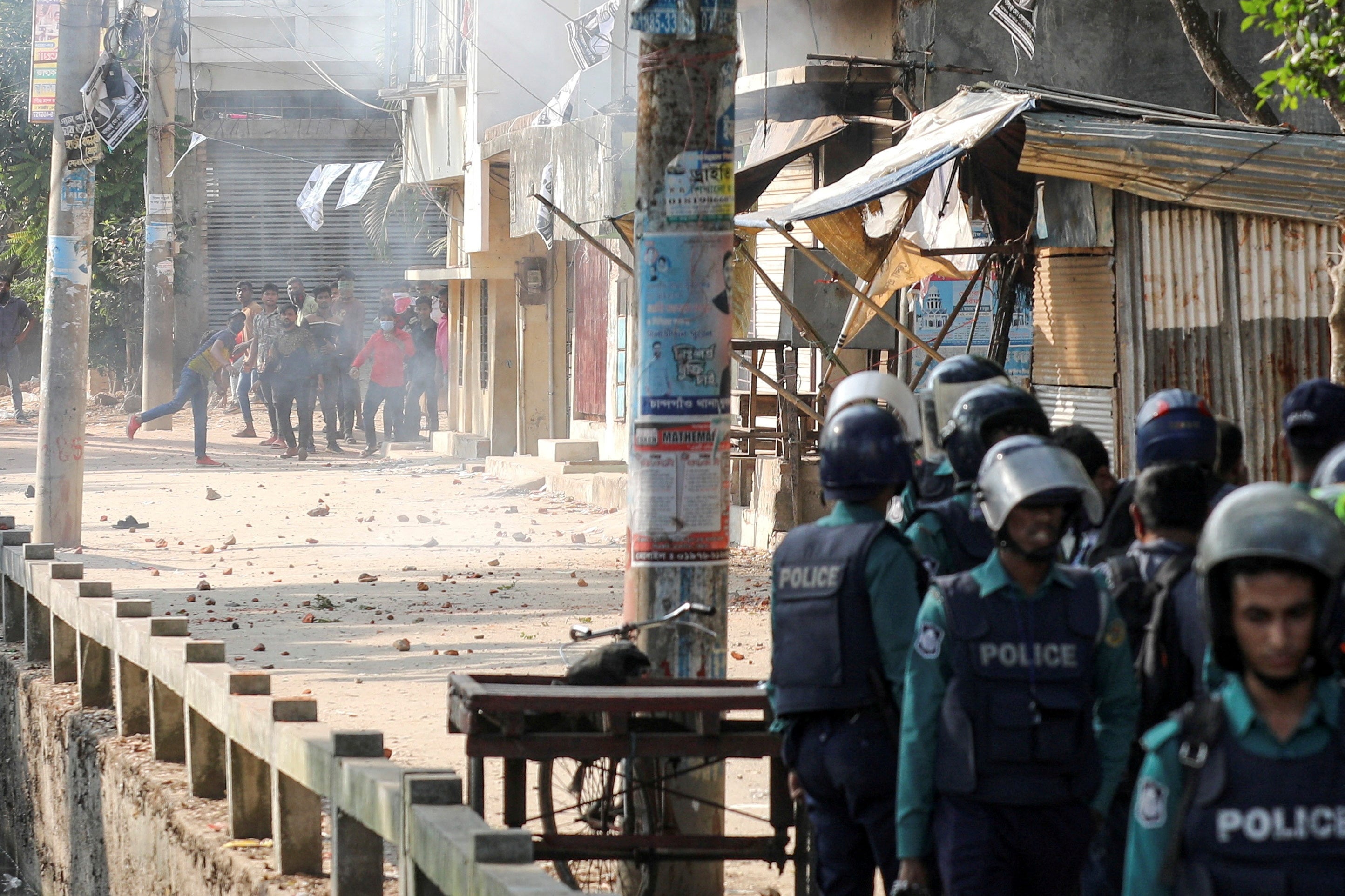 People confront with police during the 12th general election in Chattogram