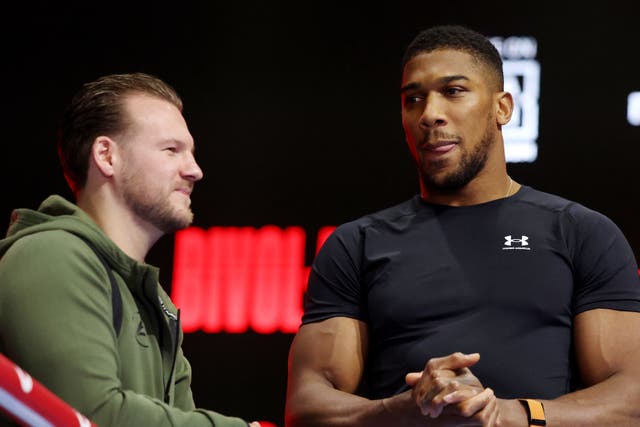 <p>Anthony Joshua (right) with coach Ben Davison ahead of a fight with Otto Wallin</p>