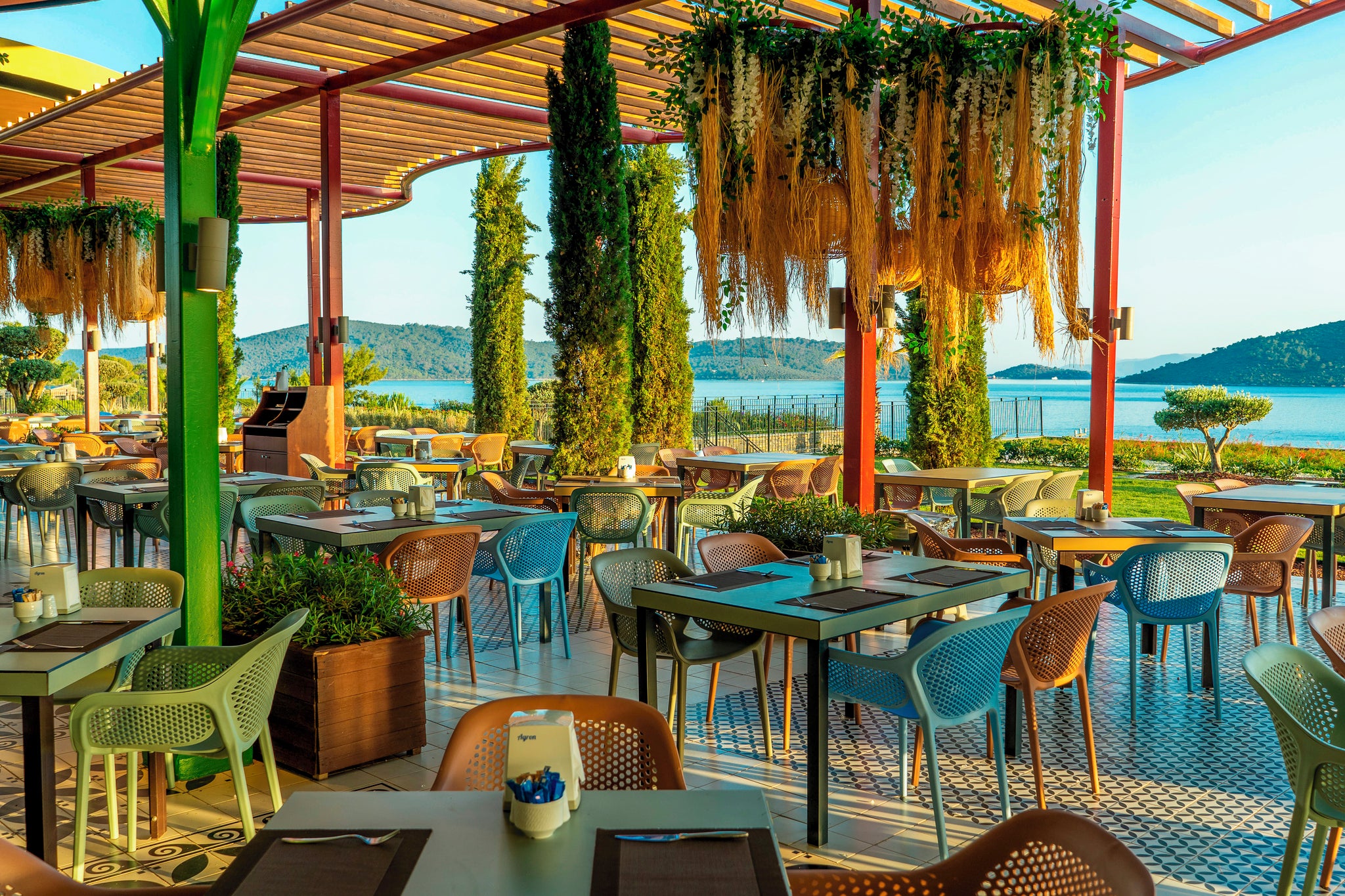 Enjoy dining al fresco within the lush, leafy surrounds of La Blanche Island resort