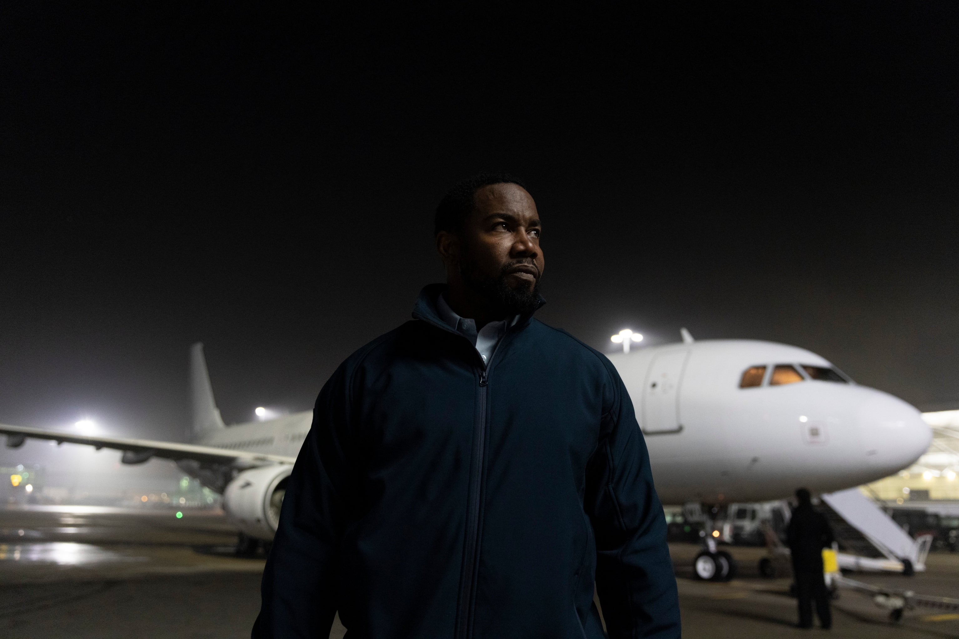 Night flight: Michael Jai White on the apron at Stansted