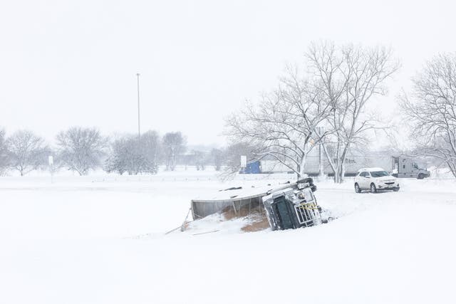 <p> A semi-truck is seen toppled over on the side of a road during a snowstorm on 9th January, 2024 in Des Moines, Iowa</p>