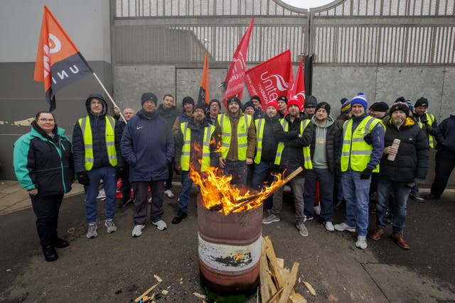 Members of Unite the Union and GMB on a picket line at Translink’s Short Strand Depot in Belfast during a 24 hour dispute over pay in December (PA)