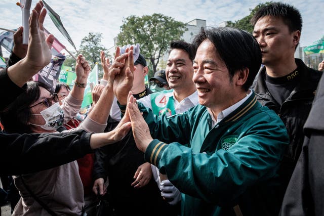 <p>Lai Ching-te greets supporters duringa campaign stop in Kaohsiung</p>