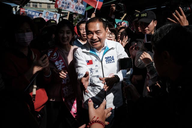 <p>Opposition presidential candidate Hou Yu-ih visiting a market during a campaign visit in Kaohsiung, Taiwan, on Wednesday</p>