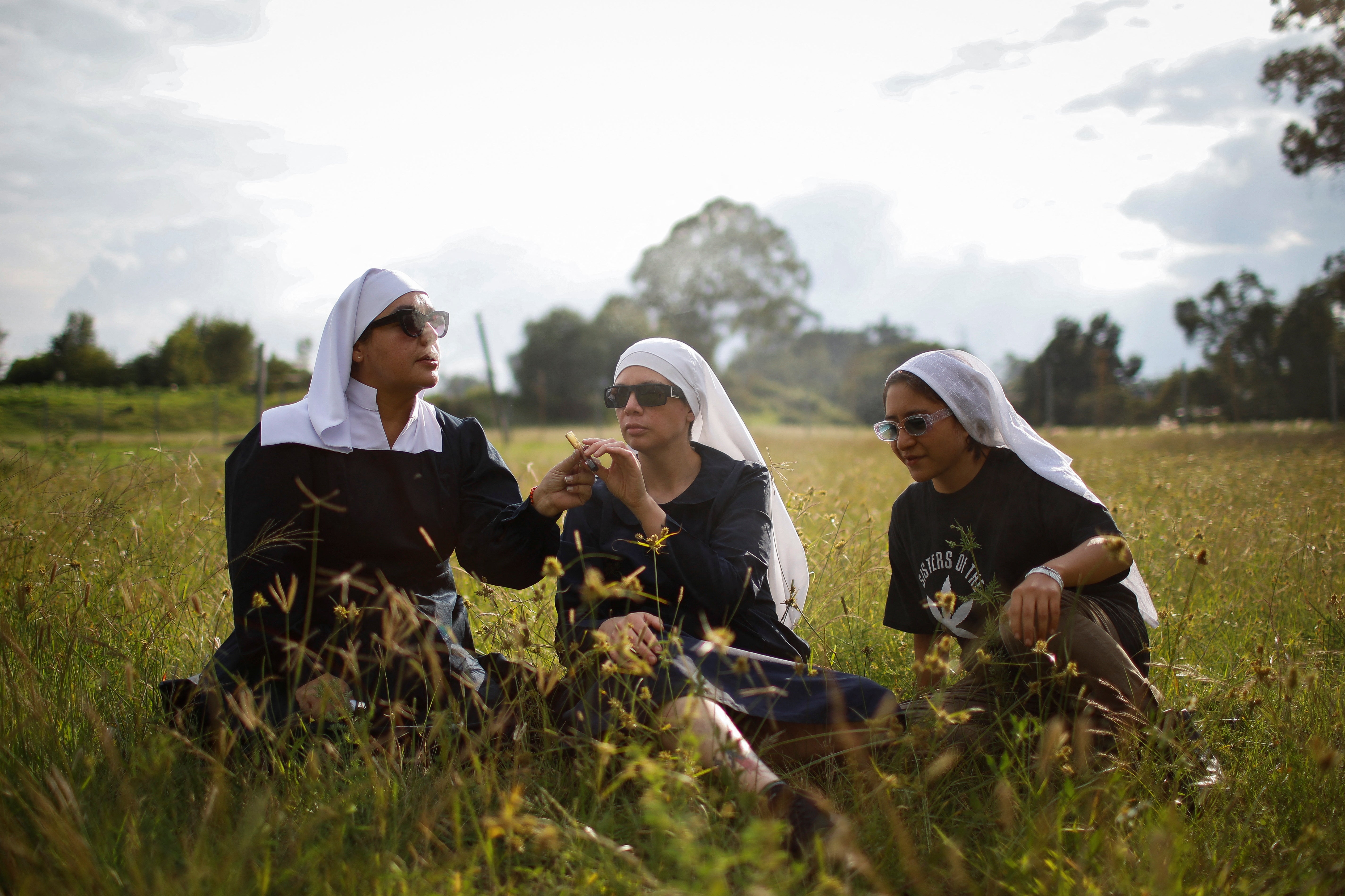 Sister Kika, Sister Bernardet and Sister Yeri, to use their online pseudonyms, smoke a joint at the Sister’s of the Valley farm