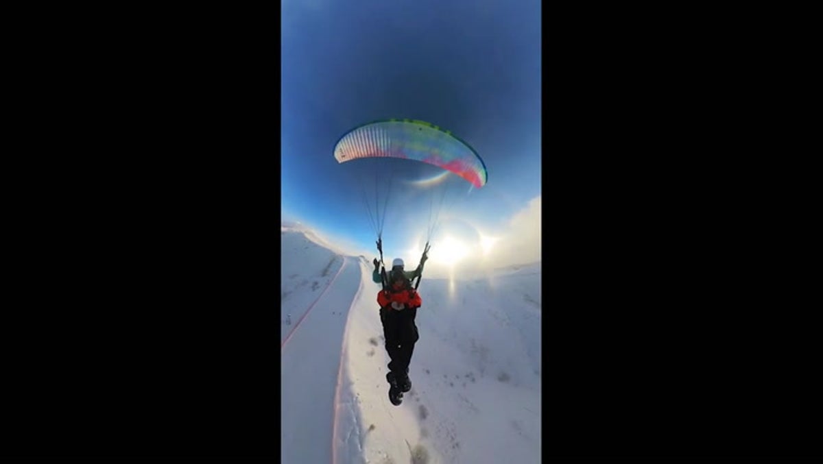 Paraglider captures stunning ‘ice halo’ over Chinese mountain