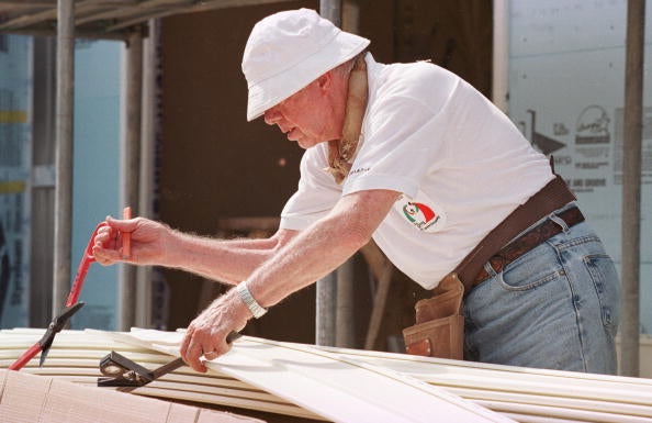 Former president Jimmy Carter works on August 6, 2001, at a construction site sponsored by the Jimmy Carter Work Project 2001 in Asan, about 60 miles south of Seoul, South Korea