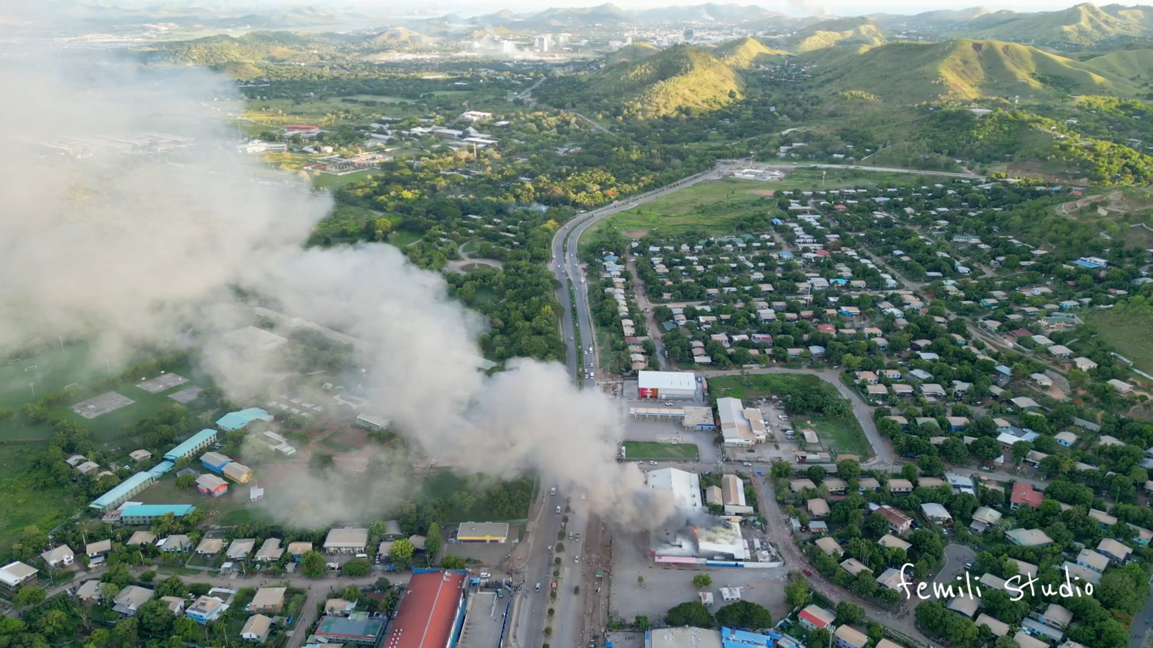 Aerial view shows a burning building amid protests over a pay cut for police that officials blamed on an administrative glitch, in Port Moresby