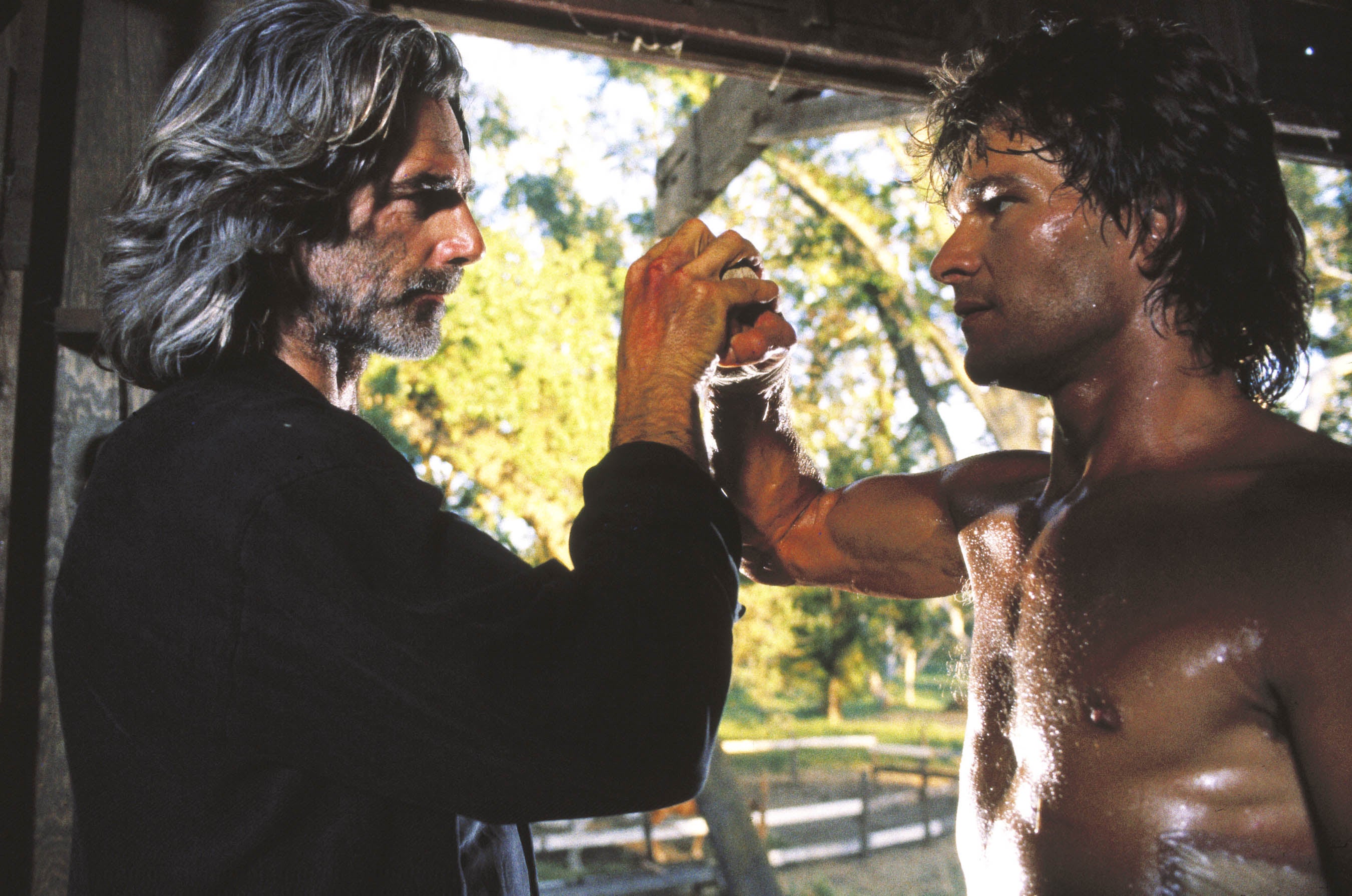 Hand to hand: Sam Elliott and Swayze in ‘Road House’