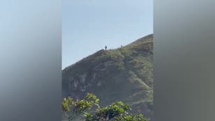 Hikers film ‘10ft tall aliens’ standing on Brazil cliff edge