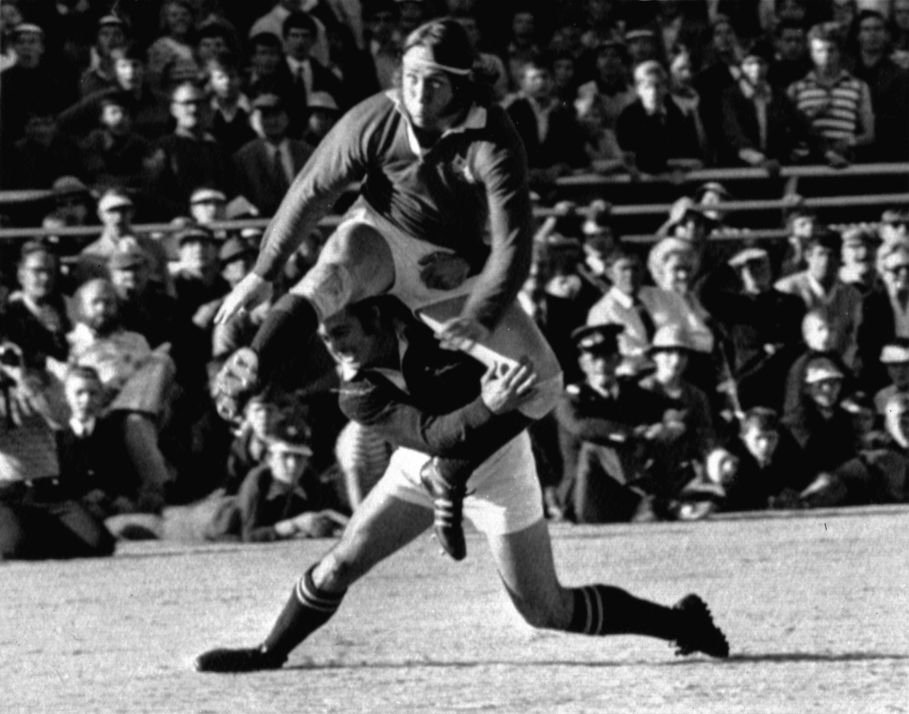 JPR Williams gets his foot to the ball despite the efforts of Springbok Chris Pope in the test match at Loftus Versfeld, Pretoria, on 22 June 1974