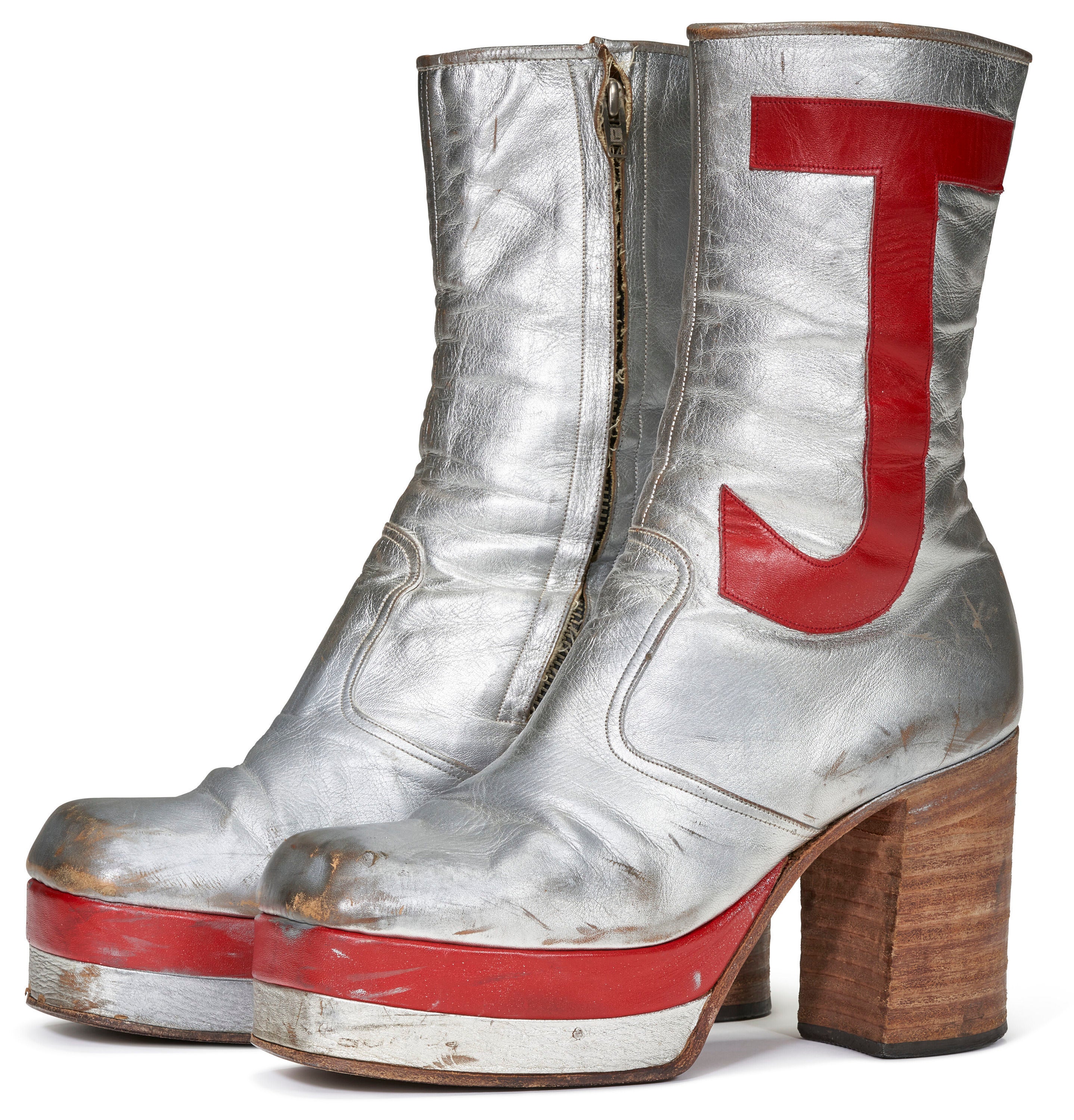 Sir Elton John ’s silver leather platform boots, embroidered in bright red with the letters EJ, will go up for auction with an estimated price of $5,000 to $10,000 (£3,900 to £7,900)